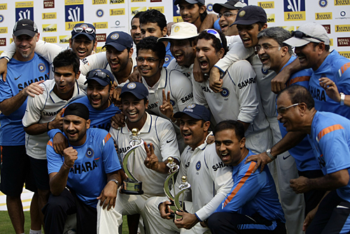 The Indian team and management celebrate going No. 1