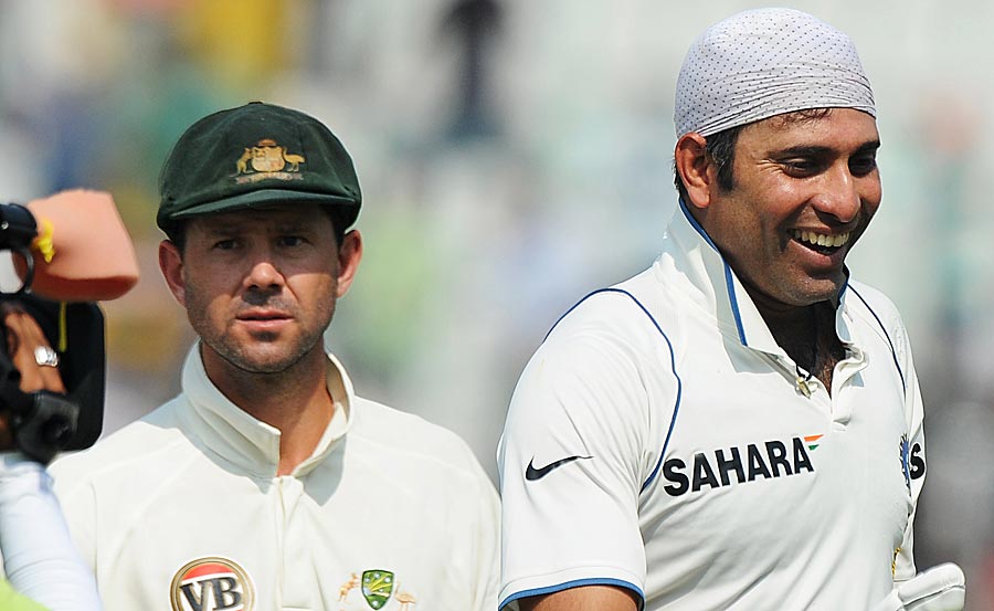 Contrasting expressions on the faces of Ricky Ponting and VVS Laxman