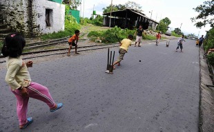 Children play cricket on deserted National Highway 55, Tindharia, December 18, 2010