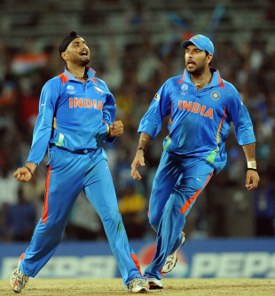 Harbhajan Singh and Yuvraj Singh celebrate the wicket of Kieron Pollard, India v West Indies, Group B, World Cup 2011, March 20, 2011