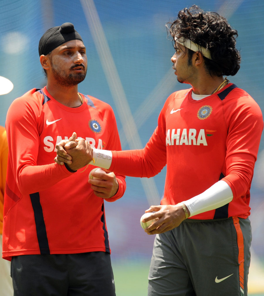 Harbhajan Singh and Sreesanth share a thought during bowling practice