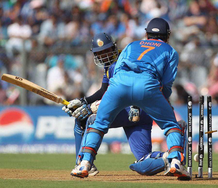 Tillakaratne Dilshan is bowled round his legs by Harbhajan Singh