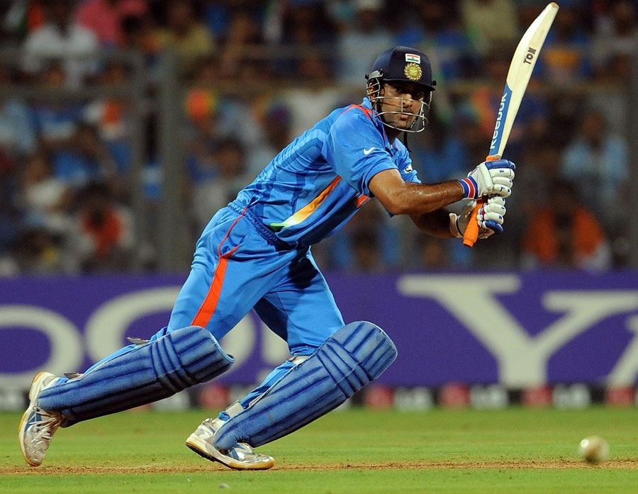 MS Dhoni drives through the off side