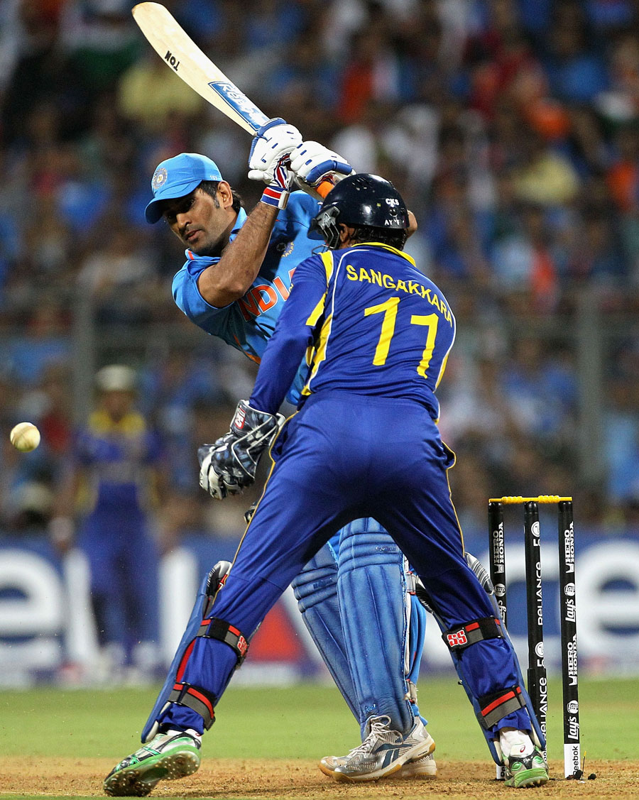 MS Dhoni tries a straight drive in the opposite direction