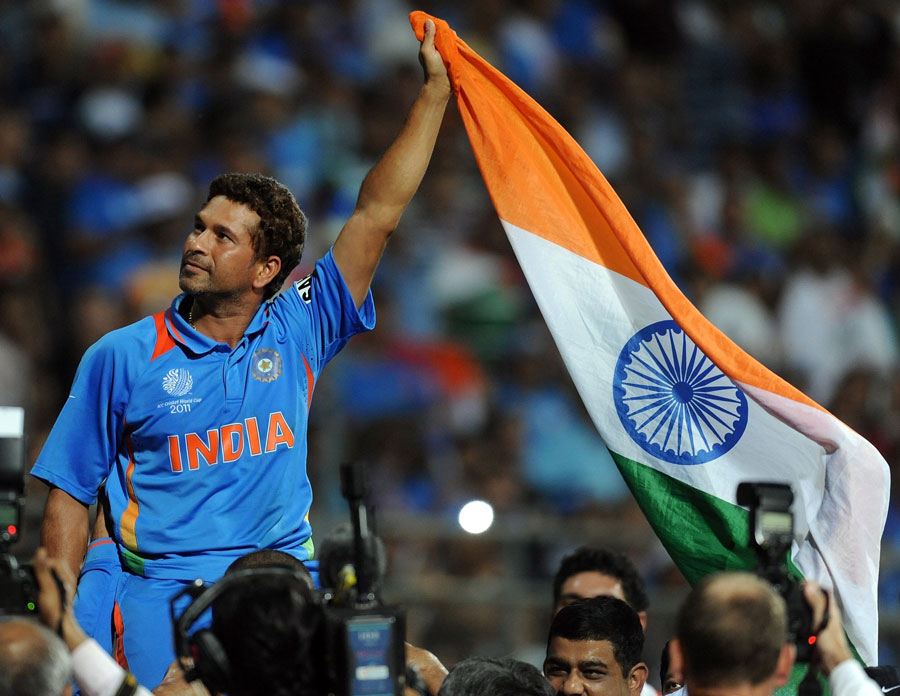 Sachin Tendulkar waves the India flag in triumph