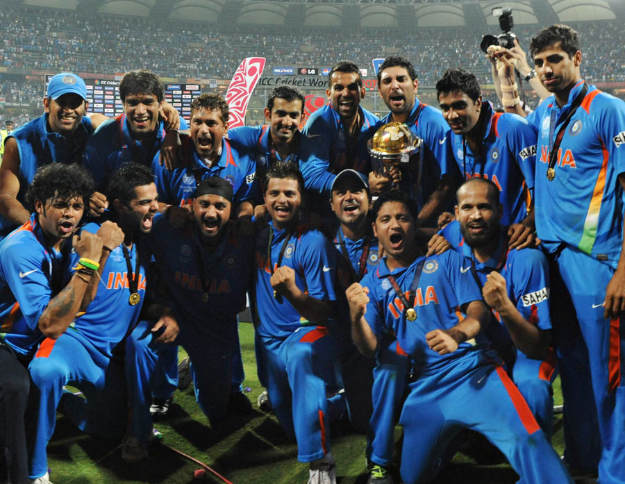 The Indian team celebrates with the World Cup