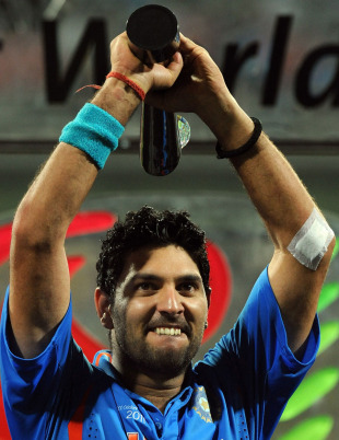 A proud Yuvraj Singh holds the Player of the Tournament trophy, India v Sri Lanka, final, World Cup 2011, Mumbai, April 2, 2011