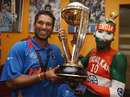 Sachin Tendulkar holds aloft the World Cup with one of his long-time fans, Sudhir Gautam