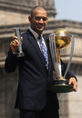 MS Dhoni with the World Cup trophy and his Man of the Match award from the final