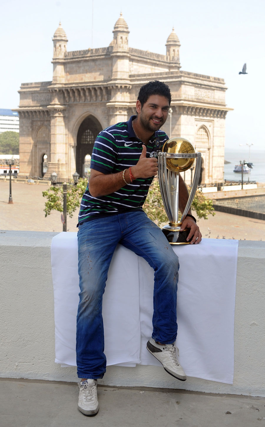 Yuvraj Singh with the World Cup trophy in front of the Gateway of India