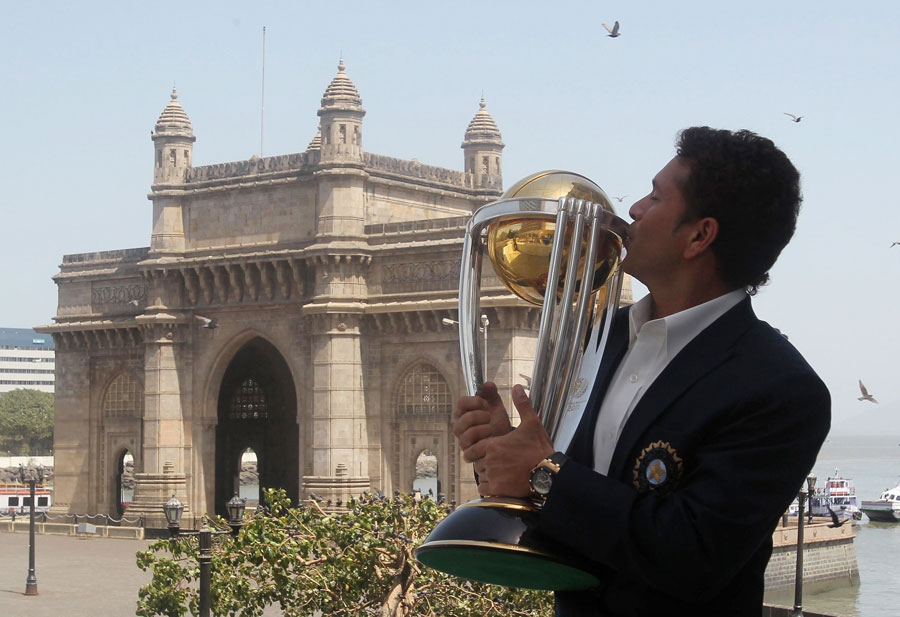 Sachin Tendulkar kisses the World Cup in front of the Gateway of India
