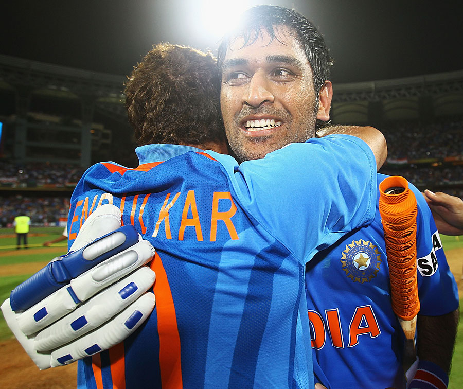 An emotional MS Dhoni is hugged by Sachin Tendulkar after India's victory