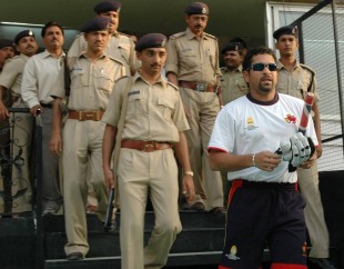 Sachin Tendulkar is accompanied by police officers as he leaves for practice, Ahmedabad, April 19, 2007