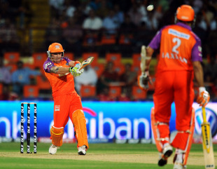 VVS Laxman watches from the other end as Brendon McCullum smashes one cross-batted, Kochi Tuskers Kerala v Royal Challengers Bangalore, IPL 2011, Kochi, April 9, 2011