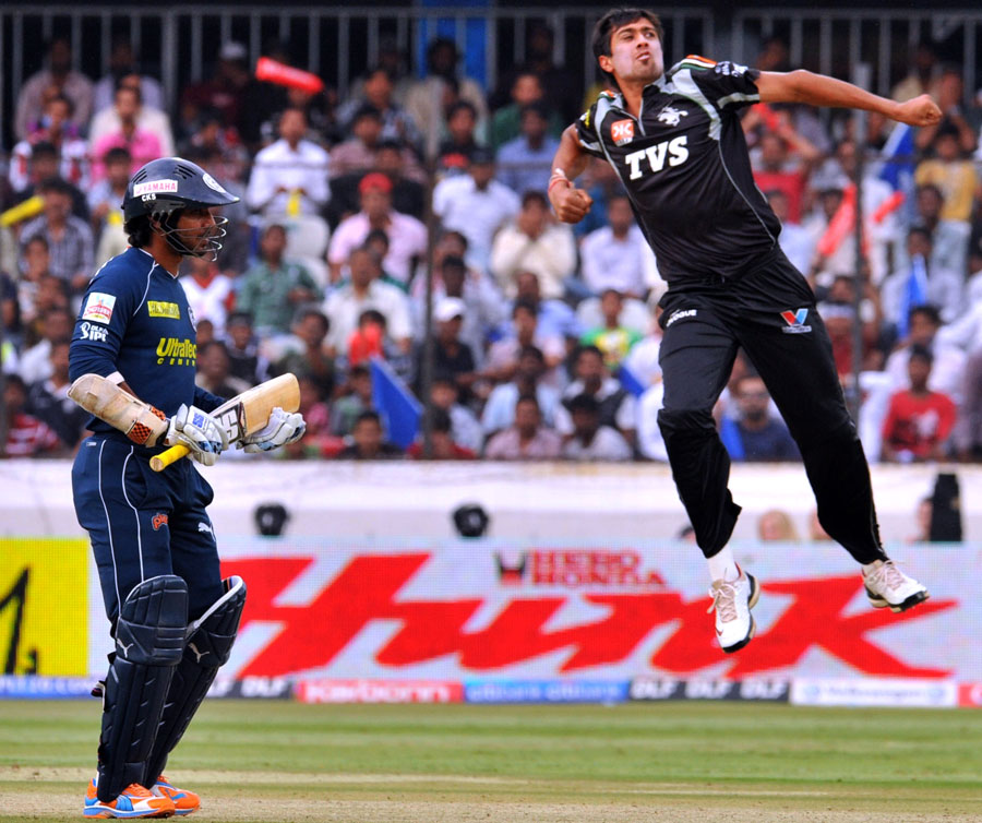 Rahul Sharma celebrates the fall of Kumar Sangakkara's wicket