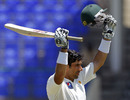 Misbah-ul-Haq's acknowledges the applause on getting to his ton