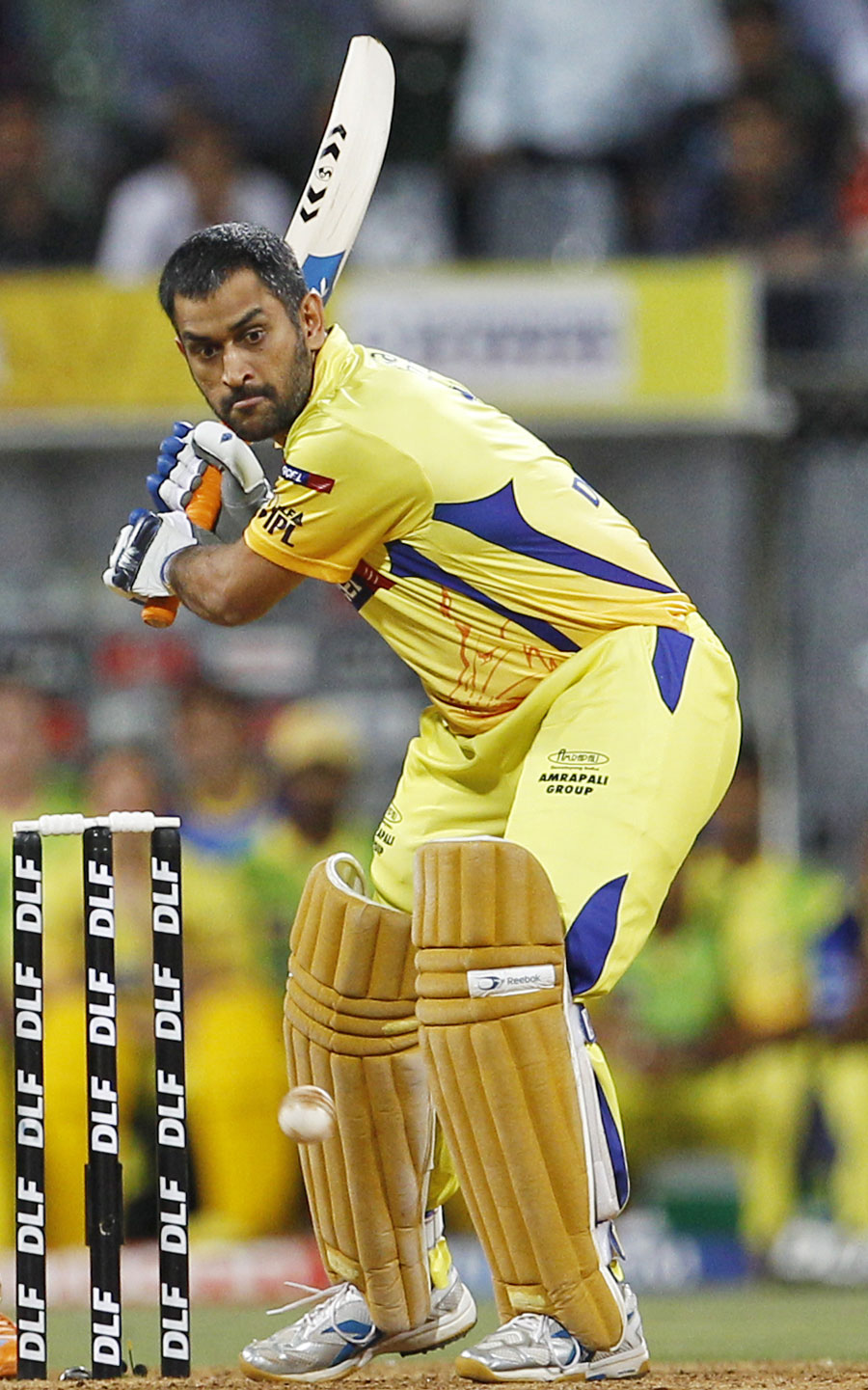 MS Dhoni is all concentration as he prepares to clobber one
