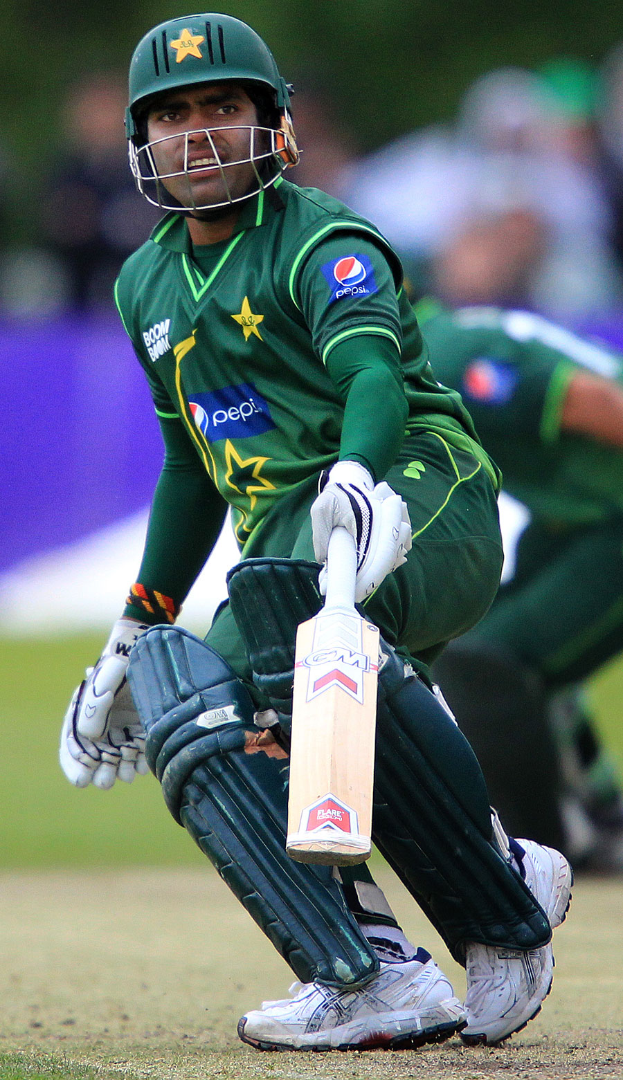 Umar Akmal carried Pakistan home with an unbeaten 60