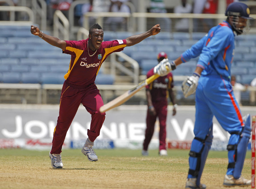 Andre Russell is delighted after having Yusuf Pathan caught behind