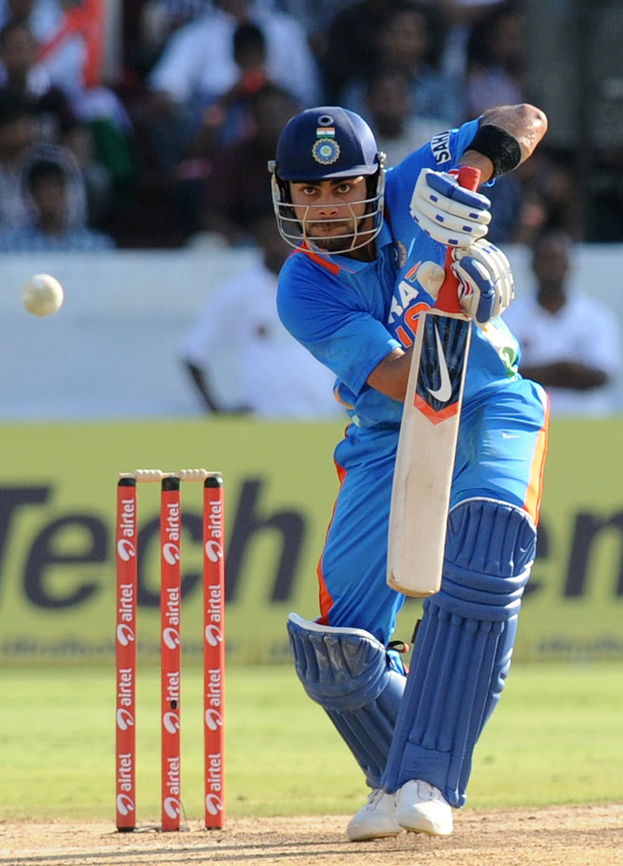 Virat Kohli punches down the ground during his 37