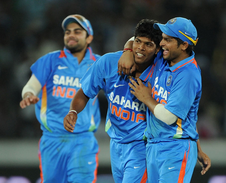 Umesh Yadav is congratulated after one of his two wickets