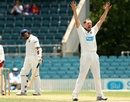 Jon Holland appeals for one of his six wickets