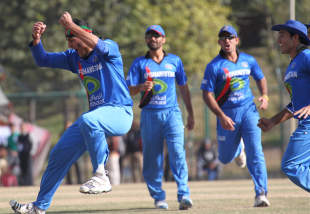 Hamid Hassan and the rest of the Afghanistan players celebrate the wicket of Irfan Ahmed during the ACC Twenty20 Cup 2011 in Kathmandu on 11th December 2011