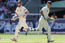 Michael Hussey and Ricky Ponting take a run