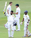 Kumar Sangakkara celebrates his century as South Africa bowlers look on