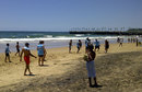 Durban locals look on as Sri Lanka enjoy a game of football following their win in the second Test, December, 30, 2011