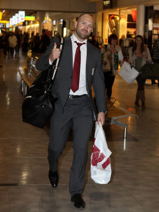 Matt Prior gives a thumbs up as he heads through the airport, Heathrow, January 2, 2012