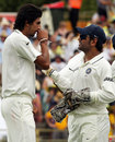 Ishant Sharma chats with MS Dhoni after taking a wicket