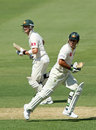 Ricky Ponting and Michael Clarke take a run