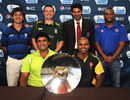 Captains pose with the ICC World Cricket League Division 5 trophy