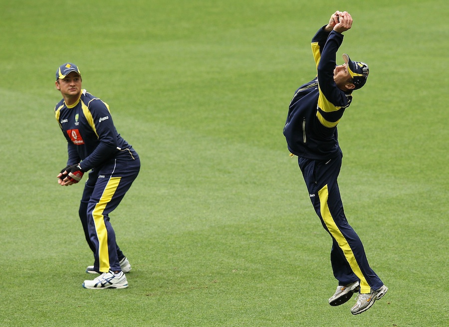 David Hussey leaps to take a catch