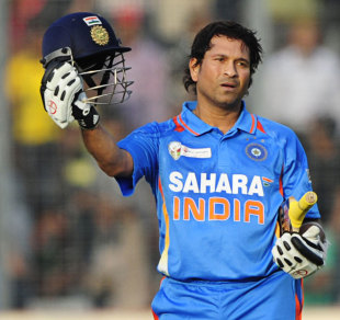 Sachin Tendulkar holds up his India helmet after reaching his century, Bangladesh v India, Asia Cup, Mirpur, March 16, 2012