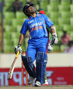 Sachin Tendulkar reacts to reaching his half-century 