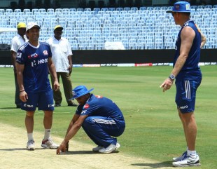 Harbhajan Singh inspects the Chepauk pitch, with Sachin Tendulkar and Shaun Pollock, Chennai, April 3, 2012