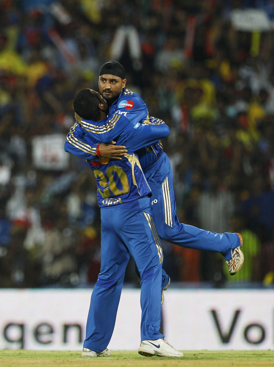 Pragyan Ojha gets a hug from his captain Harbhajan Singh