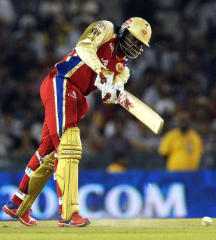 Chris Gayle thumps the ball down the ground, Kings XI Punjab v Royal Challengers Bangalore, IPL 2012, Mohali, April 20, 2012