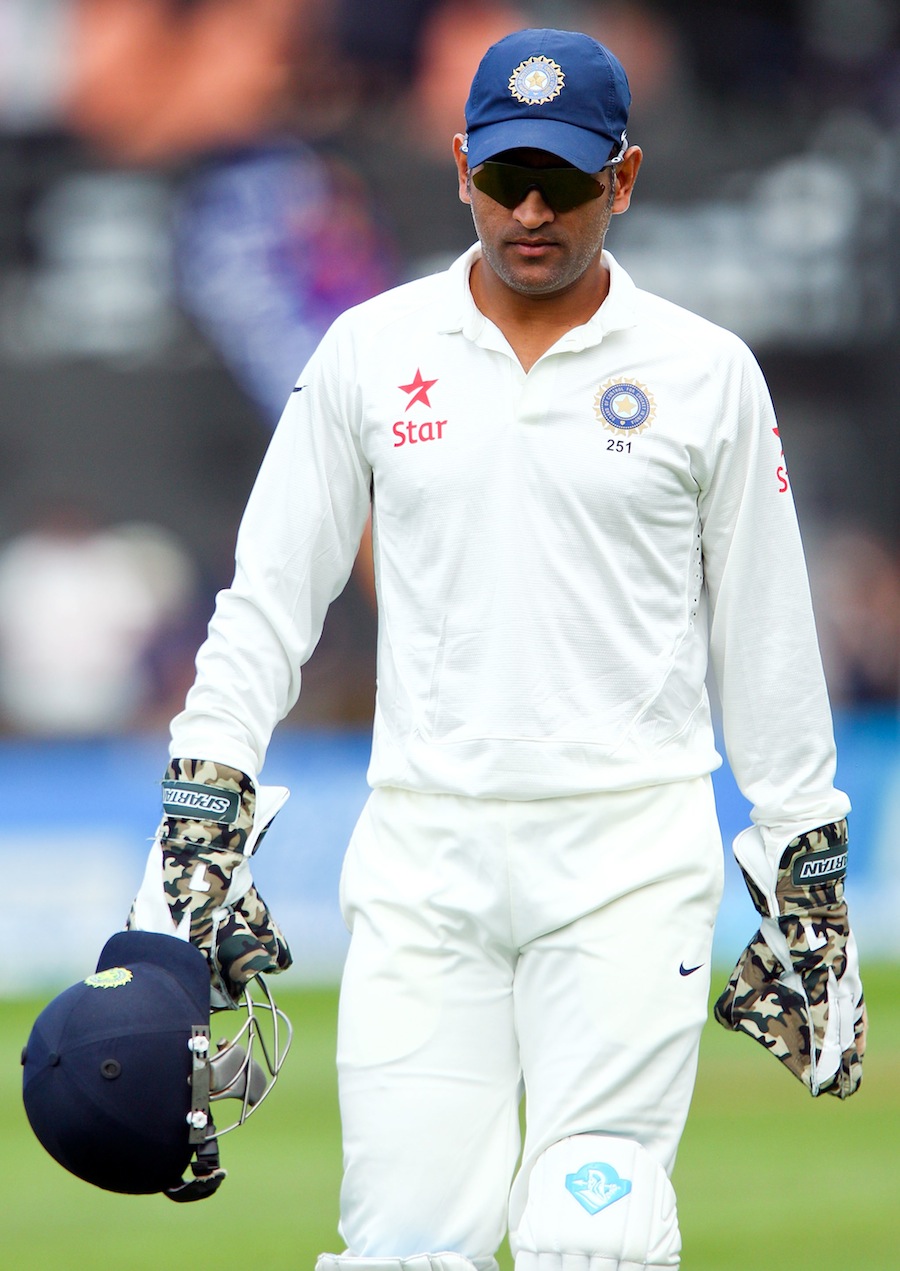 MS Dhoni walks back for the lunch break