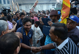 Kumar Sangakkara with the Sri Lankan sports minister Mahindananda Aluthgamage at an event to mark the Asia Cup victory, Colombo, March 9, 2014