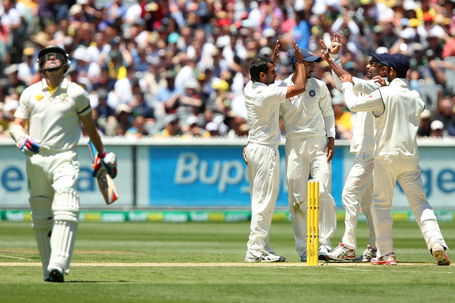 Chris Rogers walks off after edging Mohammed Shami behind