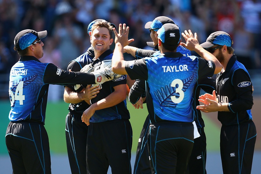 Trent Boult is mobbed after bowling Mitchell Marsh for a duck