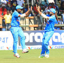 Sanju Samson and Kedar Jadhav celebrate a wicket, Zimbabwe v India, 2nd T20I, Harare, July 19, 2015