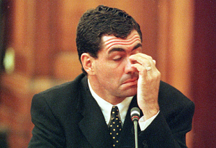 Former South African cricket captain Hansie Cronje appears to tire during his cross-examination at the King Commission of Inquiry into allegations of cricket match-fixing in Cape Town 22 June 2000.