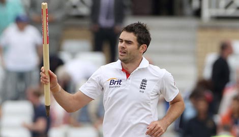 James Anderson collects a stump after taking his 11th wicket and sealing England's win