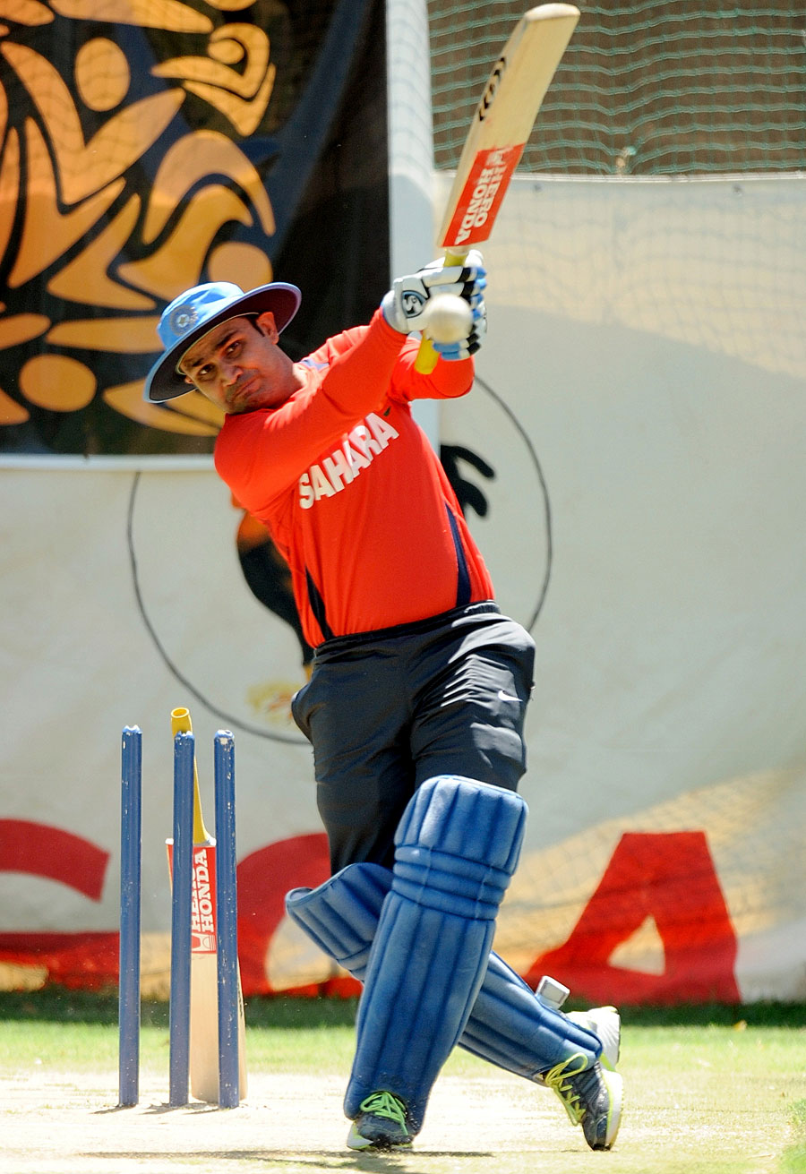 Virender Sehwag unleashes a big shot in the nets