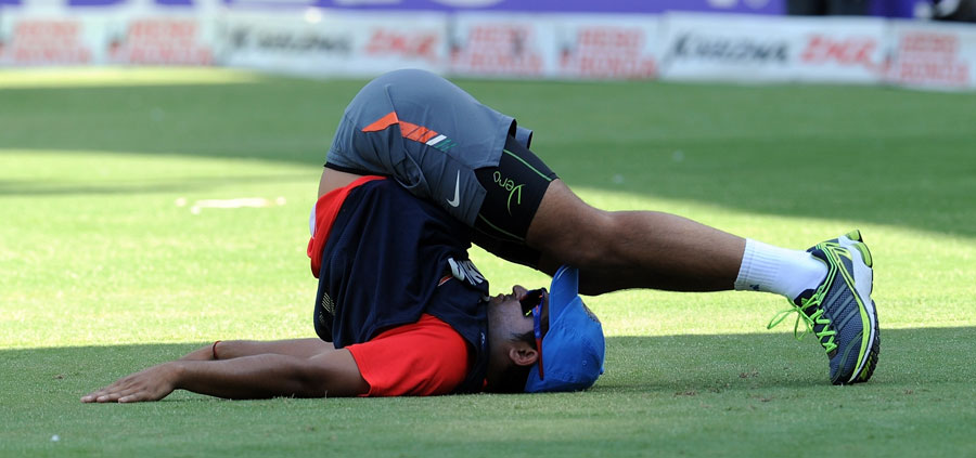 Suresh Raina loosens up during India's training session