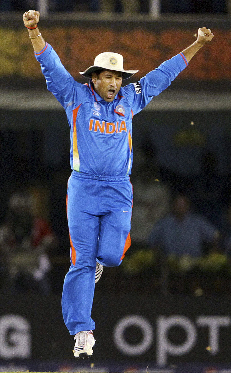 Sachin Tendulkar celebrates India's win with an ecstatic leap